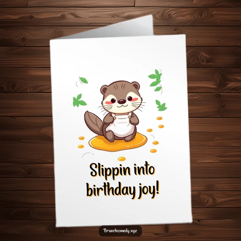 Funny Free Printable Birthday Card: A curious otter in a tiny apron slides happily down a sticky syrup stream.